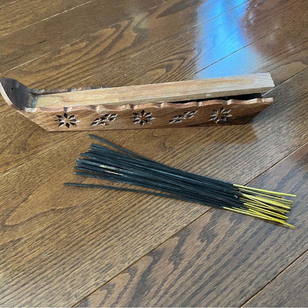 Set of incense sticks with a wooden storage box